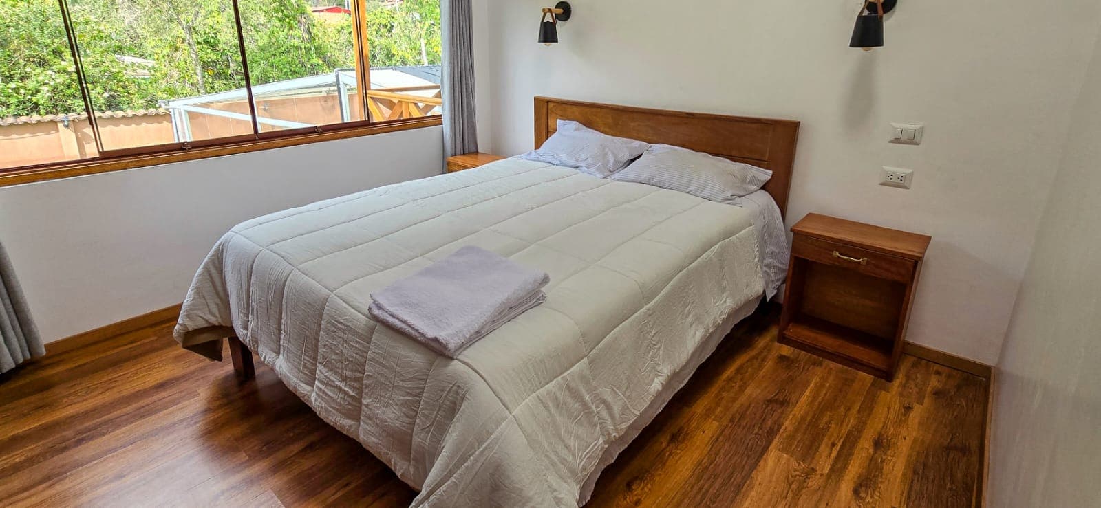 Double bedroom with wooden floors