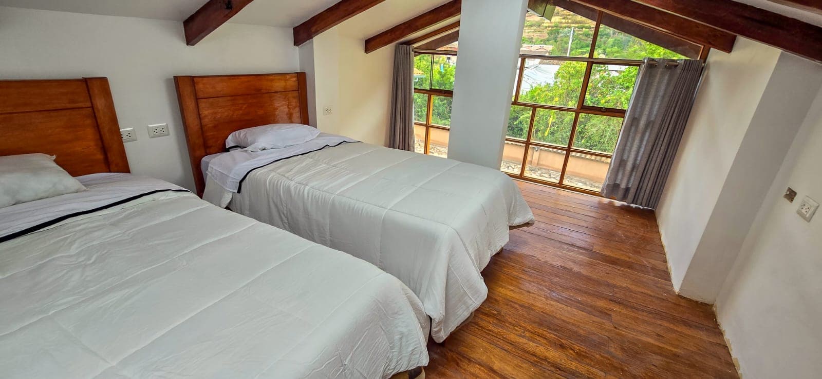 Twin bedroom with mountain window view